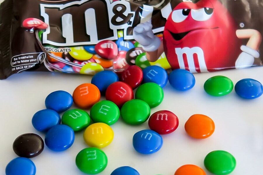 sugary m&ms with the mascot giving a thumbs down