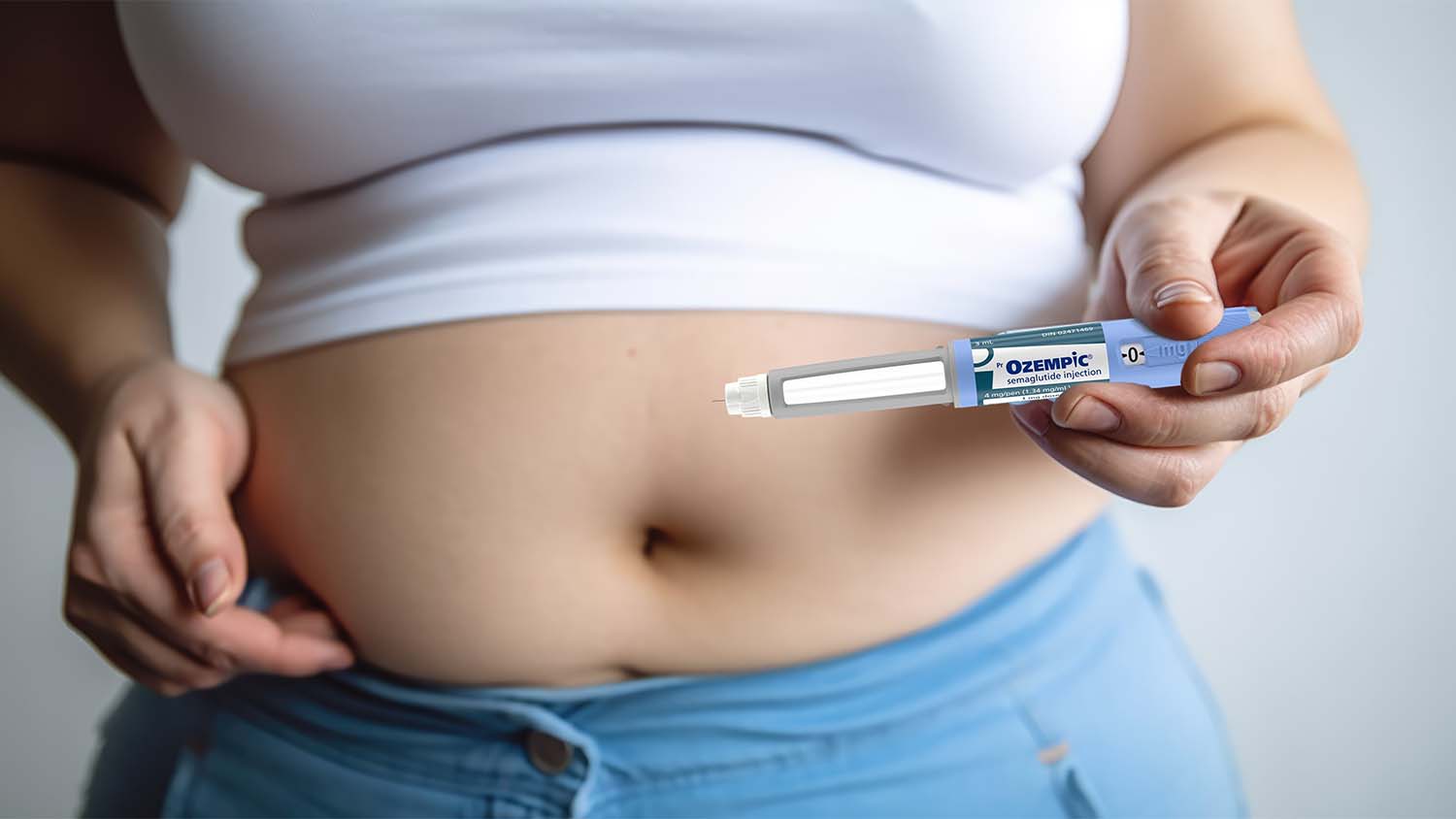 a woman injecting Ozempic into her stomach